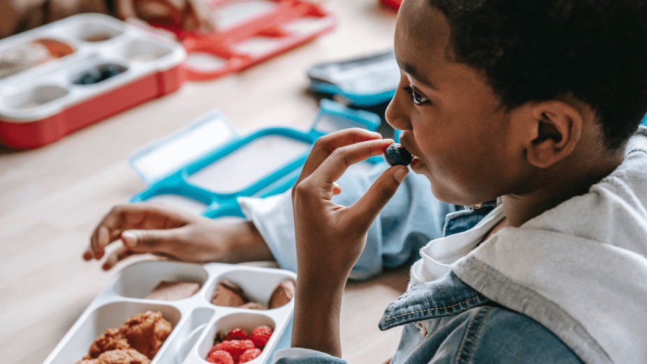 Boy Eating Grapes